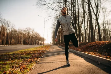 Photo sur Aluminium Jogging Male athlete doing exercise on workout outdoors