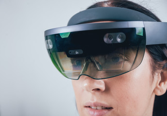 Woman wearing augmented reality goggles.