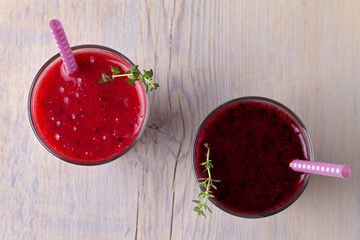 Berry smoothie, garnished with thyme