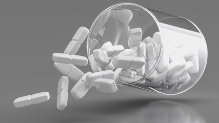 Weiße Tabletten fliegen aus einer Dose