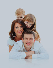 Happy family smiling. Isolated over a white background.
