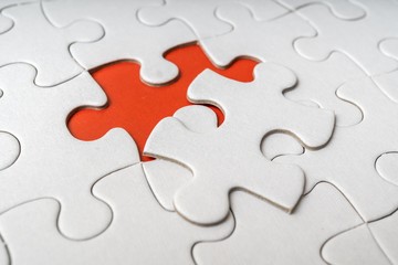 One last piece of white empty puzzle is missing.