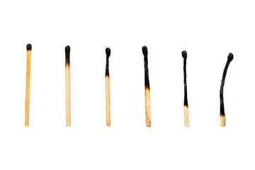 Set of eight burnt wooden matches arranged in ascending order isolated on white background