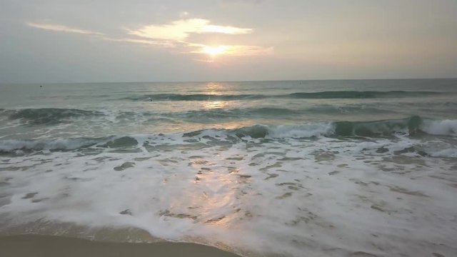 Sunset Twilight Dusk Beach Wave Sun. Video. Incredibly beautiful sunset on the beach in Thailand. Sun, sky, sea, waves and sand. A holiday by the sea