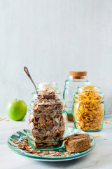 Variety of cold quick breakfast cereals in glass jars , healthy eating for kids and athletes. concept of a healthy lifestyle. gluten-free diet