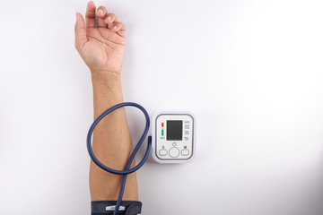Male checking blood pressure on white background