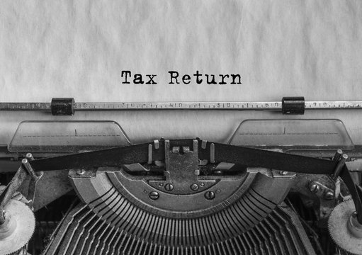 Tax Return, text typed on retro vintage typewriter. Close-up