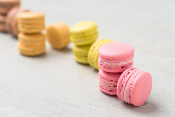 Colorful macarons close-up. Macarons are small round delicious french confections, made with meringue and sweet flavored filling. Often found in french bakeries, these tasty treats are light & crisp!
