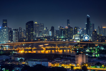 Fototapeta na wymiar Bangkok thailand cityscape at night many tower near river