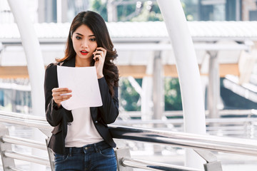 Fototapeta premium Portrait of businesswoman using smartphone