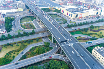 Naklejka premium aerial view of road junction in modern city