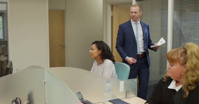 4K Business manager with bad attitude yelling at male employee & throwing papers. Slow motion.