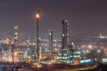 Fototapeta na wymiar Oil refinery or chemical plant at Blue night sky