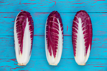 Line of three fresh radicchio or Italian chicory