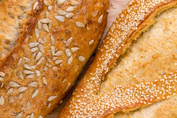 Close up on the crusts of two seed rolls