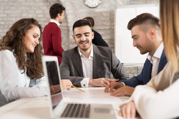 Young  businessteam having meeting indoors