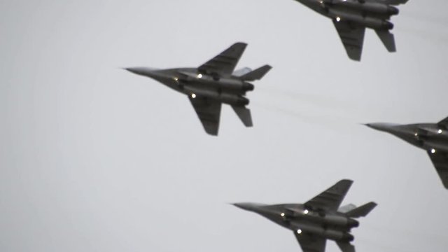 Air show in the sky above the Krasnodar airport flight school. Airshow in honor of Defender of the Fatherland. MiG-29 in the sky.