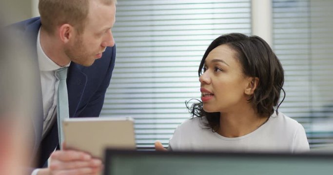 4K Office worker with bad attitude being unhelpful & moody towards male colleague. Slow motion.