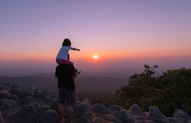 Fototapeta premium Happy father and daughter enjoying on sunset background