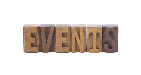 EVENTS spelled in wooden block letters