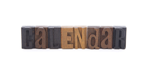 CALENDAR spelled in wooden block letters