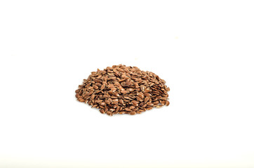 Pile of flax seeds isolated on white background close-up, top view