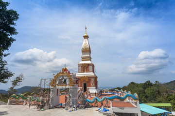 Beautiful pagoda of Thepnimit temple on high peak of Patong