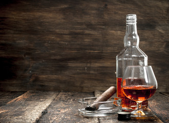 French cognac with a smoking cigar.