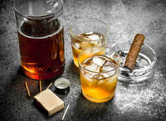 Scotch whiskey with a cigar.