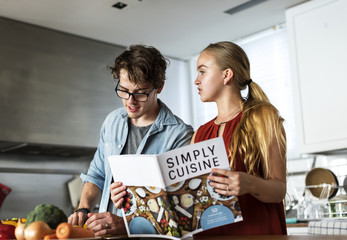 Caucasian couple cooking in the kitchen together