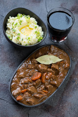 Traditional Irish meal for Saint Patrick’s Day including beer and beef stew with champ, studio shot