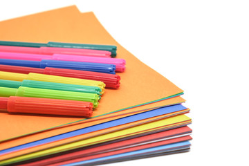 Colourful paper and magic pen on white background