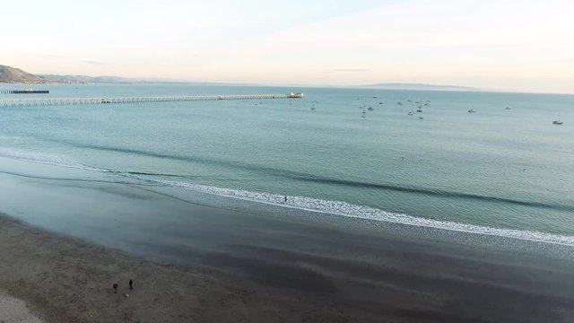 Drone view - flying upwards at the pier - pointing to sea