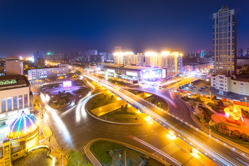 Fototapeta na wymiar road junction and modern buildings at night