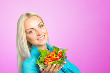 beautiful girl eating a salad