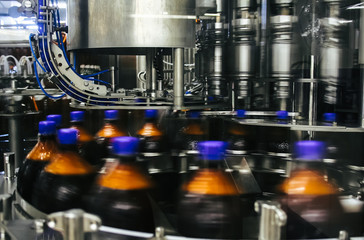 Plastic bottles moving on a conveyor belt