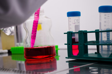 A pipette inside a cell medium