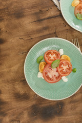 Italian salad with tomatoes and mozzarella cheese