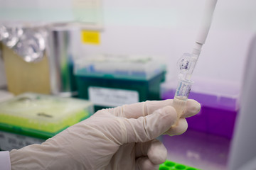 A working hand with a micropipette and test tube 2