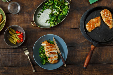 Top view ghicken steak fried vegetables wooden table. Dinner table