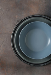 Empty plate on dark stone background. Top view