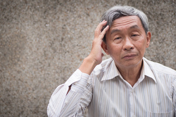 stressed hopeless senior old man suffering from chronic headache pain, migraine, stress, hangover