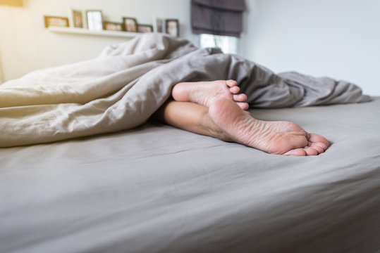 Close up of barefoot,Feet on the bed after waking up