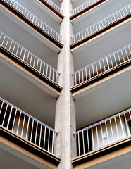 Abstract recording of the outside entrances of an old ugly high-rise building with lots of...