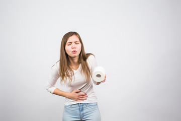 Woman with toilet paper and problems with her digestive system