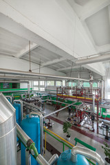 Industrial boiler room. Complex system of pipelines, pumps.