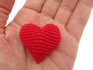 Obraz premium Red heart in hand. Donation, care and love