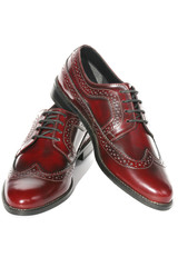 Brogues of brown genuine leather isolated on a white background. 