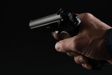 Male hand with gun