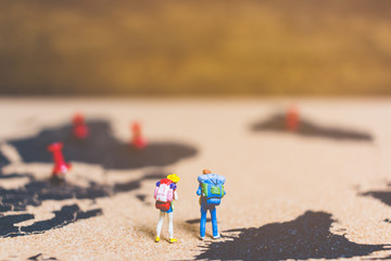 Fototapeta na wymiar Miniature people travelers walking on world map ,